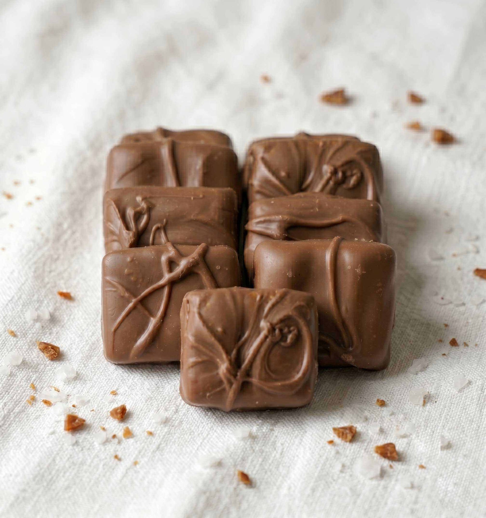 Close-up of butter toffee covered in creamy milk chocolate