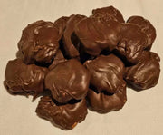 handcrafted caramel pecan clusters covered in dark chocolate