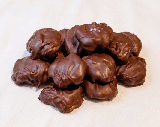 handcrafted caramel pecan clusters dipped in dark chocolate