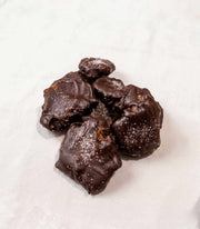 Handmade caramel pecan clusters with chocolate and sea salt