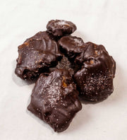 Handmade caramel pecan clusters with chocolate and sea salt