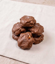 Handmade caramel pecan clusters with chocolate and sea salt