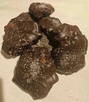 Handmade caramel pecan clusters with sea salt and chocolate