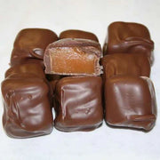 Mixed milk and dark chocolate covered caramels in sealed packaging
